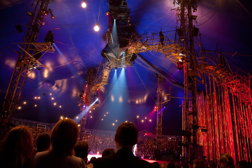 Spectators watch representation of Cirque du Soleil