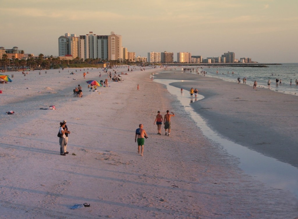 Visitors enjoy an evening stroll at Clearwater Beach, Florida.